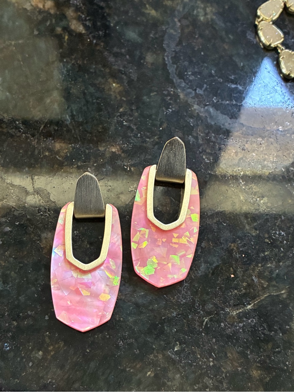 Kendra Scott gold Kailyn earrings in coral illusion.